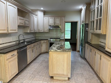 This beautiful custom built home offers 3 bedrooms/3 bathrooms on Singing Bridge Golf Course in Michigan - for sale on GolfHomes.com, golf home, golf lot