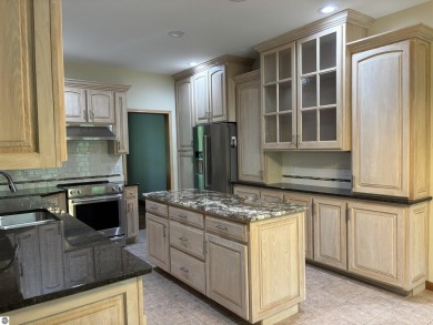 This beautiful custom built home offers 3 bedrooms/3 bathrooms on Singing Bridge Golf Course in Michigan - for sale on GolfHomes.com, golf home, golf lot
