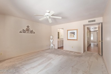 Tucked in a gated 55+ community along the OMNI Tucson National on Omni Tucson National Golf Resort and Spa - Catalina in Arizona - for sale on GolfHomes.com, golf home, golf lot