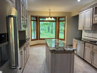 This beautiful custom built home offers 3 bedrooms/3 bathrooms on Singing Bridge Golf Course in Michigan - for sale on GolfHomes.com, golf home, golf lot