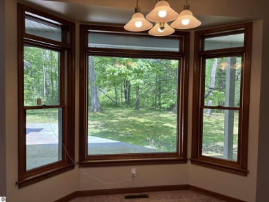 This beautiful custom built home offers 3 bedrooms/3 bathrooms on Singing Bridge Golf Course in Michigan - for sale on GolfHomes.com, golf home, golf lot