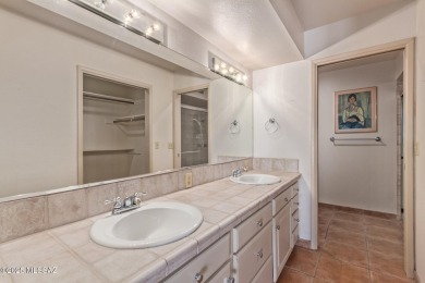 Tucked in a gated 55+ community along the OMNI Tucson National on Omni Tucson National Golf Resort and Spa - Catalina in Arizona - for sale on GolfHomes.com, golf home, golf lot