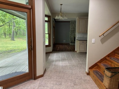 This beautiful custom built home offers 3 bedrooms/3 bathrooms on Singing Bridge Golf Course in Michigan - for sale on GolfHomes.com, golf home, golf lot
