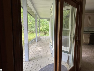 This beautiful custom built home offers 3 bedrooms/3 bathrooms on Singing Bridge Golf Course in Michigan - for sale on GolfHomes.com, golf home, golf lot