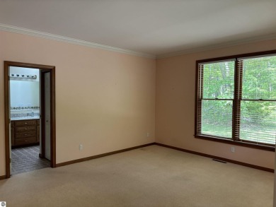 This beautiful custom built home offers 3 bedrooms/3 bathrooms on Singing Bridge Golf Course in Michigan - for sale on GolfHomes.com, golf home, golf lot