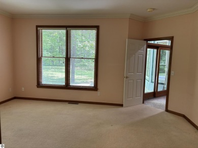 This beautiful custom built home offers 3 bedrooms/3 bathrooms on Singing Bridge Golf Course in Michigan - for sale on GolfHomes.com, golf home, golf lot
