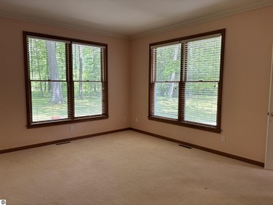 This beautiful custom built home offers 3 bedrooms/3 bathrooms on Singing Bridge Golf Course in Michigan - for sale on GolfHomes.com, golf home, golf lot