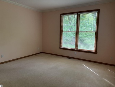 This beautiful custom built home offers 3 bedrooms/3 bathrooms on Singing Bridge Golf Course in Michigan - for sale on GolfHomes.com, golf home, golf lot