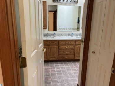 This beautiful custom built home offers 3 bedrooms/3 bathrooms on Singing Bridge Golf Course in Michigan - for sale on GolfHomes.com, golf home, golf lot