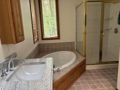 This beautiful custom built home offers 3 bedrooms/3 bathrooms on Singing Bridge Golf Course in Michigan - for sale on GolfHomes.com, golf home, golf lot