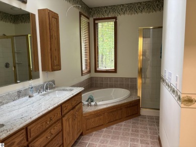 This beautiful custom built home offers 3 bedrooms/3 bathrooms on Singing Bridge Golf Course in Michigan - for sale on GolfHomes.com, golf home, golf lot