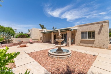 Tucked in a gated 55+ community along the OMNI Tucson National on Omni Tucson National Golf Resort and Spa - Catalina in Arizona - for sale on GolfHomes.com, golf home, golf lot