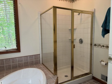 This beautiful custom built home offers 3 bedrooms/3 bathrooms on Singing Bridge Golf Course in Michigan - for sale on GolfHomes.com, golf home, golf lot