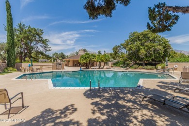 Tucked in a gated 55+ community along the OMNI Tucson National on Omni Tucson National Golf Resort and Spa - Catalina in Arizona - for sale on GolfHomes.com, golf home, golf lot