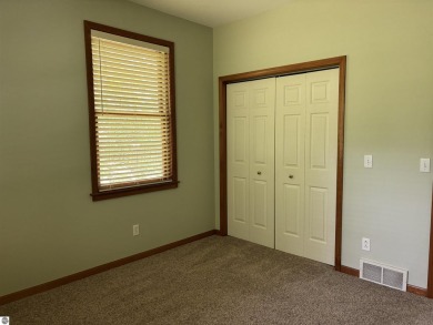 This beautiful custom built home offers 3 bedrooms/3 bathrooms on Singing Bridge Golf Course in Michigan - for sale on GolfHomes.com, golf home, golf lot