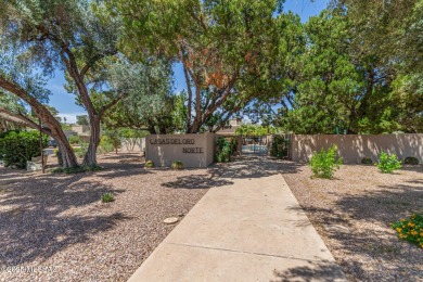 Tucked in a gated 55+ community along the OMNI Tucson National on Omni Tucson National Golf Resort and Spa - Catalina in Arizona - for sale on GolfHomes.com, golf home, golf lot