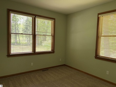 This beautiful custom built home offers 3 bedrooms/3 bathrooms on Singing Bridge Golf Course in Michigan - for sale on GolfHomes.com, golf home, golf lot