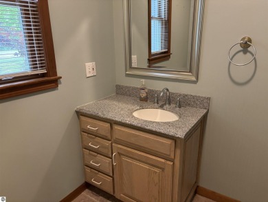 This beautiful custom built home offers 3 bedrooms/3 bathrooms on Singing Bridge Golf Course in Michigan - for sale on GolfHomes.com, golf home, golf lot