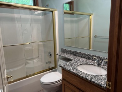 This beautiful custom built home offers 3 bedrooms/3 bathrooms on Singing Bridge Golf Course in Michigan - for sale on GolfHomes.com, golf home, golf lot