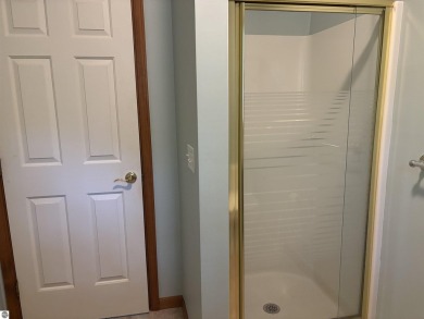 This beautiful custom built home offers 3 bedrooms/3 bathrooms on Singing Bridge Golf Course in Michigan - for sale on GolfHomes.com, golf home, golf lot