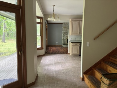 This beautiful custom built home offers 3 bedrooms/3 bathrooms on Singing Bridge Golf Course in Michigan - for sale on GolfHomes.com, golf home, golf lot