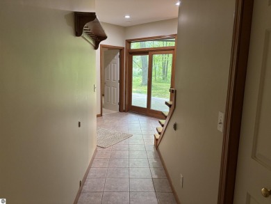 This beautiful custom built home offers 3 bedrooms/3 bathrooms on Singing Bridge Golf Course in Michigan - for sale on GolfHomes.com, golf home, golf lot