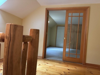 This beautiful custom built home offers 3 bedrooms/3 bathrooms on Singing Bridge Golf Course in Michigan - for sale on GolfHomes.com, golf home, golf lot