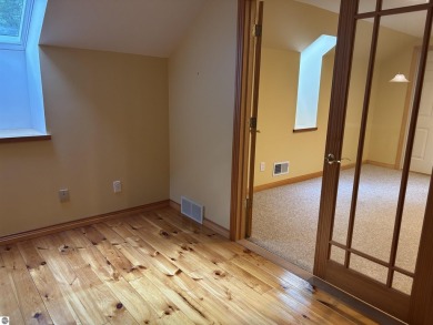 This beautiful custom built home offers 3 bedrooms/3 bathrooms on Singing Bridge Golf Course in Michigan - for sale on GolfHomes.com, golf home, golf lot