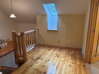 This beautiful custom built home offers 3 bedrooms/3 bathrooms on Singing Bridge Golf Course in Michigan - for sale on GolfHomes.com, golf home, golf lot