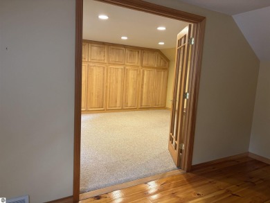 This beautiful custom built home offers 3 bedrooms/3 bathrooms on Singing Bridge Golf Course in Michigan - for sale on GolfHomes.com, golf home, golf lot