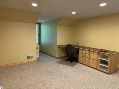This beautiful custom built home offers 3 bedrooms/3 bathrooms on Singing Bridge Golf Course in Michigan - for sale on GolfHomes.com, golf home, golf lot