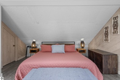 This studio condo offers stunning Lake Bellaire and sunset views on Shanty Creek Golf Course in Michigan - for sale on GolfHomes.com, golf home, golf lot