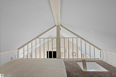 This studio condo offers stunning Lake Bellaire and sunset views on Shanty Creek Golf Course in Michigan - for sale on GolfHomes.com, golf home, golf lot