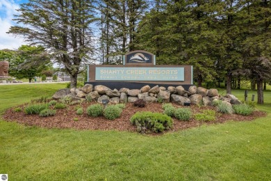 This studio condo offers stunning Lake Bellaire and sunset views on Shanty Creek Golf Course in Michigan - for sale on GolfHomes.com, golf home, golf lot