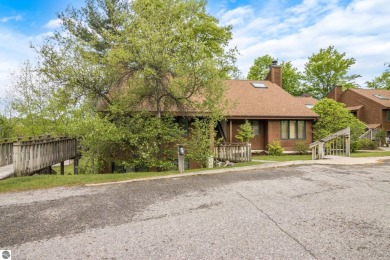 This studio condo offers stunning Lake Bellaire and sunset views on Shanty Creek Golf Course in Michigan - for sale on GolfHomes.com, golf home, golf lot