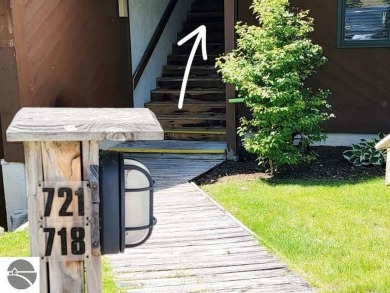 This studio condo offers stunning Lake Bellaire and sunset views on Shanty Creek Golf Course in Michigan - for sale on GolfHomes.com, golf home, golf lot