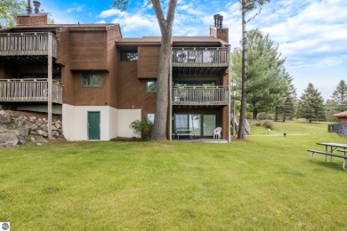 This studio condo offers stunning Lake Bellaire and sunset views on Shanty Creek Golf Course in Michigan - for sale on GolfHomes.com, golf home, golf lot