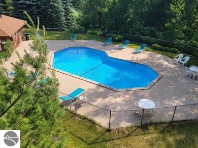 This studio condo offers stunning Lake Bellaire and sunset views on Shanty Creek Golf Course in Michigan - for sale on GolfHomes.com, golf home, golf lot