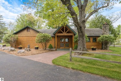 This studio condo offers stunning Lake Bellaire and sunset views on Shanty Creek Golf Course in Michigan - for sale on GolfHomes.com, golf home, golf lot