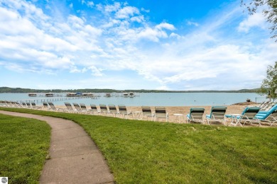 This studio condo offers stunning Lake Bellaire and sunset views on Shanty Creek Golf Course in Michigan - for sale on GolfHomes.com, golf home, golf lot