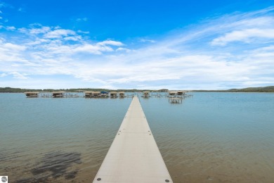 This studio condo offers stunning Lake Bellaire and sunset views on Shanty Creek Golf Course in Michigan - for sale on GolfHomes.com, golf home, golf lot