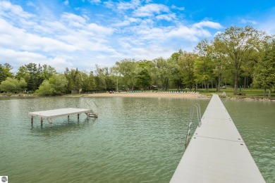 This studio condo offers stunning Lake Bellaire and sunset views on Shanty Creek Golf Course in Michigan - for sale on GolfHomes.com, golf home, golf lot