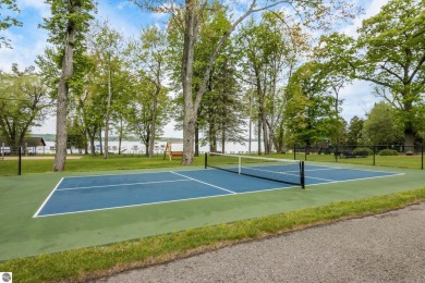 This studio condo offers stunning Lake Bellaire and sunset views on Shanty Creek Golf Course in Michigan - for sale on GolfHomes.com, golf home, golf lot