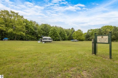 This studio condo offers stunning Lake Bellaire and sunset views on Shanty Creek Golf Course in Michigan - for sale on GolfHomes.com, golf home, golf lot