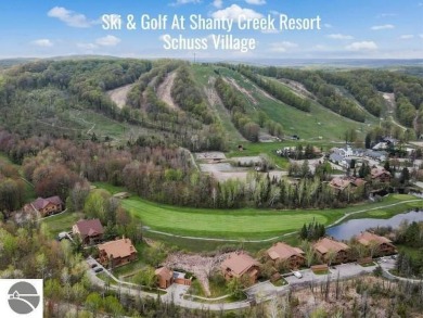 This studio condo offers stunning Lake Bellaire and sunset views on Shanty Creek Golf Course in Michigan - for sale on GolfHomes.com, golf home, golf lot