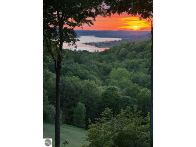 This studio condo offers stunning Lake Bellaire and sunset views on Shanty Creek Golf Course in Michigan - for sale on GolfHomes.com, golf home, golf lot