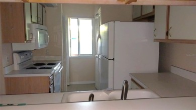 Indulge in comfort and convenience with this 2-bedroom on La Cita Country Club in Florida - for sale on GolfHomes.com, golf home, golf lot