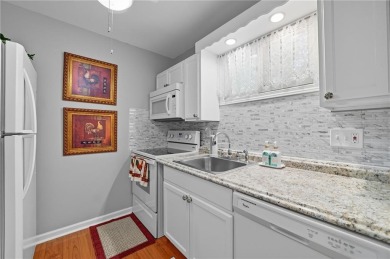 Vacation living at a price you'll love! This lower-level condo on The Highlands Course at Lake Arrowhead in Georgia - for sale on GolfHomes.com, golf home, golf lot
