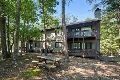 Vacation living at a price you'll love! This lower-level condo on The Highlands Course at Lake Arrowhead in Georgia - for sale on GolfHomes.com, golf home, golf lot