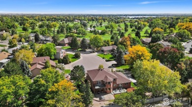 All-brick charmer on a cul-de-sac! This gorgeous home in the on The Olde Course At Loveland in Colorado - for sale on GolfHomes.com, golf home, golf lot